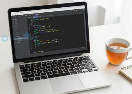 A clean, modern Python programming workspace with a laptop screen displaying readable Python code, a cup of tea, and a notebook with handwritten notes, soft natural lighting, no text or numbers visible on objects